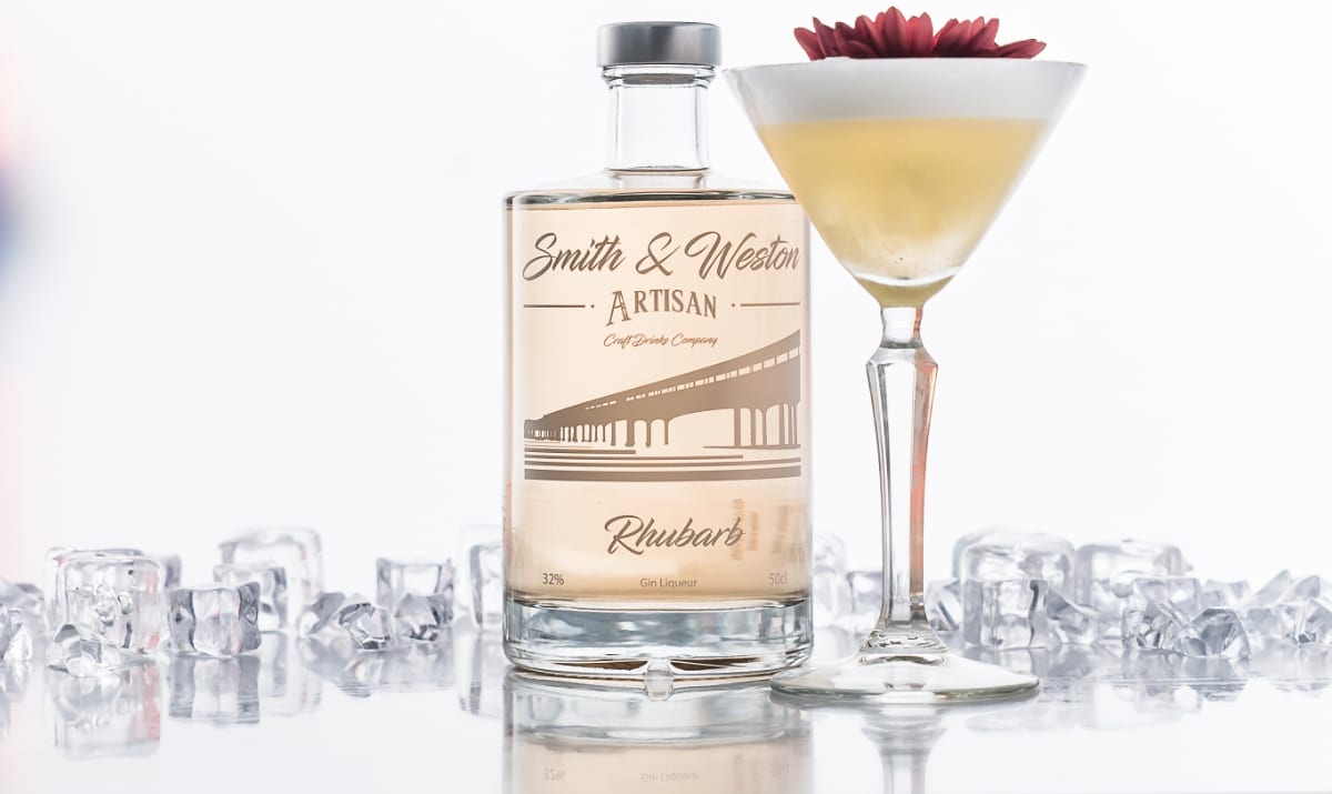 smith and western bottle beside a cocktail