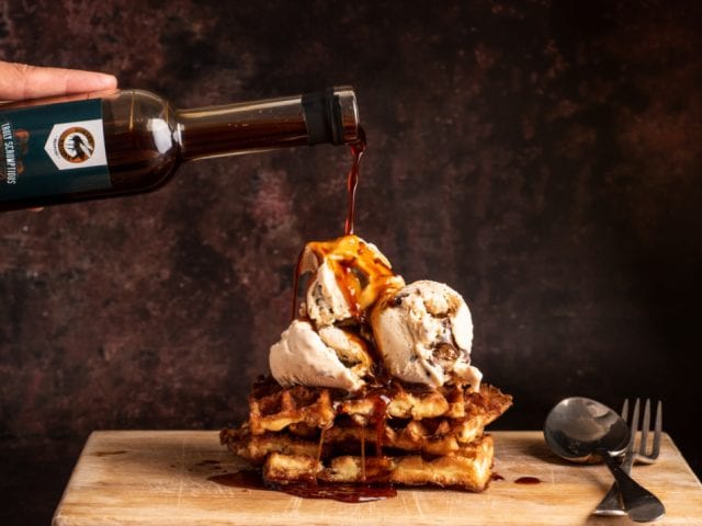 waffles and ice cream with dorset nectar sauce drizzeld over the top