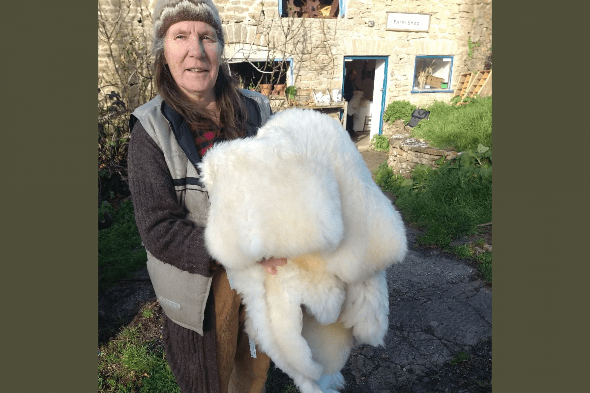 Farmer Ellen from Tamarisk Farm holding a sheepskin