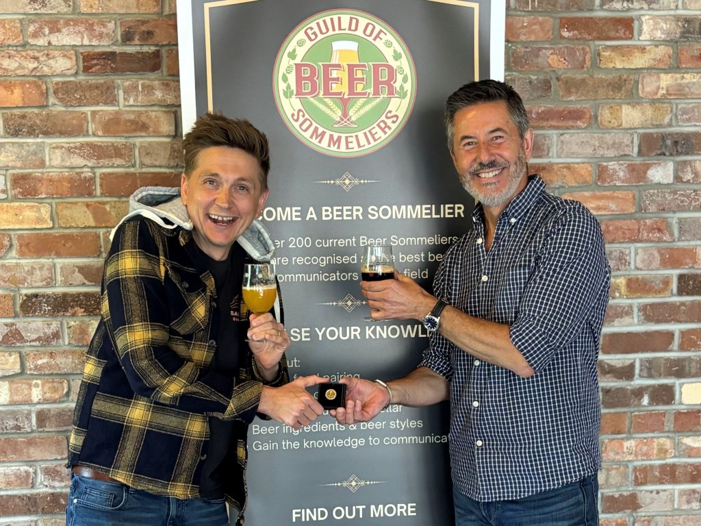 Ryan Perry proudly receives his Beer Sommelier badge following successful completion of the Guild of Beer Sommeliers accreditation programme.