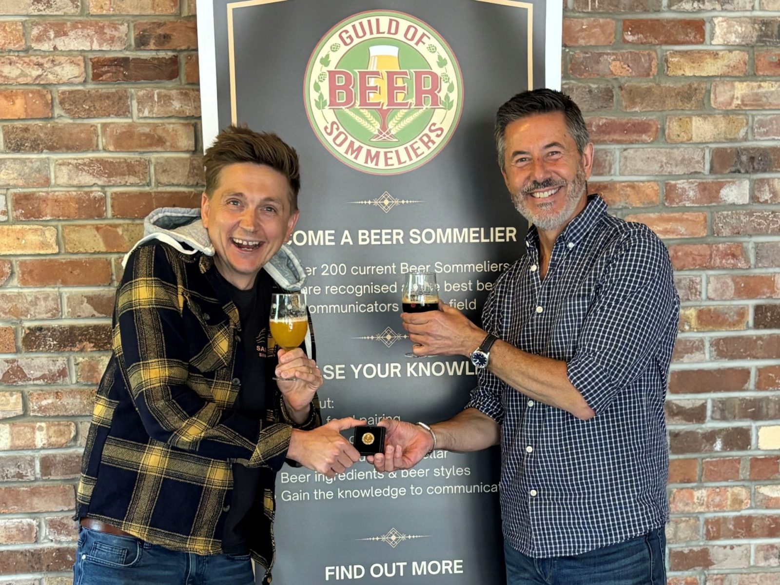 Ryan Perry proudly receives his Beer Sommelier badge following successful completion of the Guild of Beer Sommeliers accreditation programme.