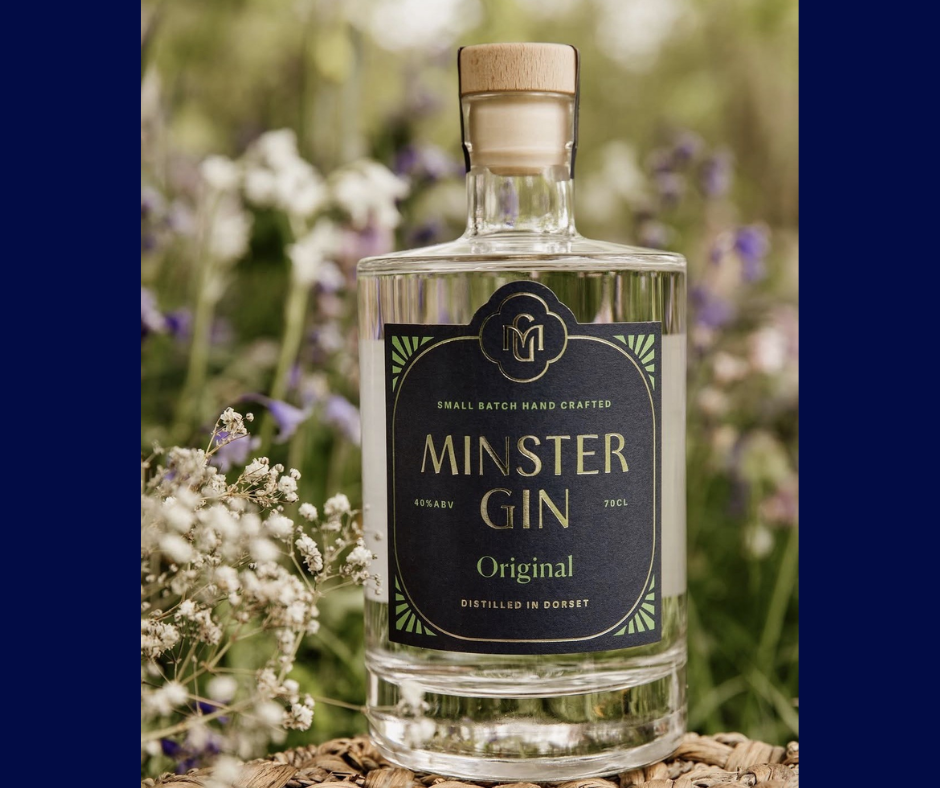 Minster Gin Original by Beaucroft Beverages, a handcrafted small-batch Dorset gin, displayed amongst wildflowers and countryside blooms in Wimborne Minster.