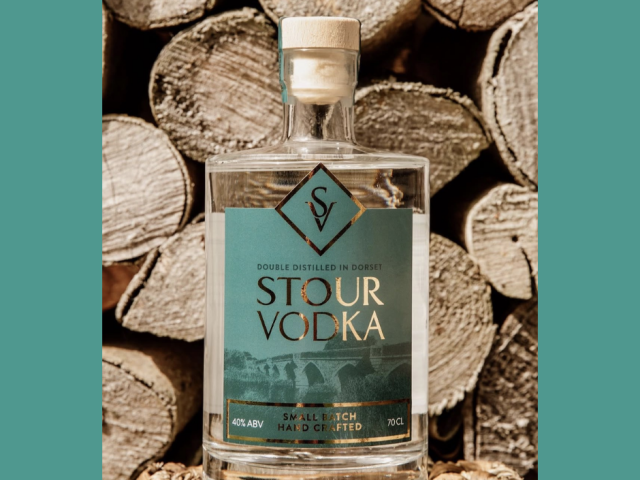 Stour Vodka by Beaucroft Beverages, an artisan Dorset vodka handmade in small batches and photographed in front of a natural wood backdrop.