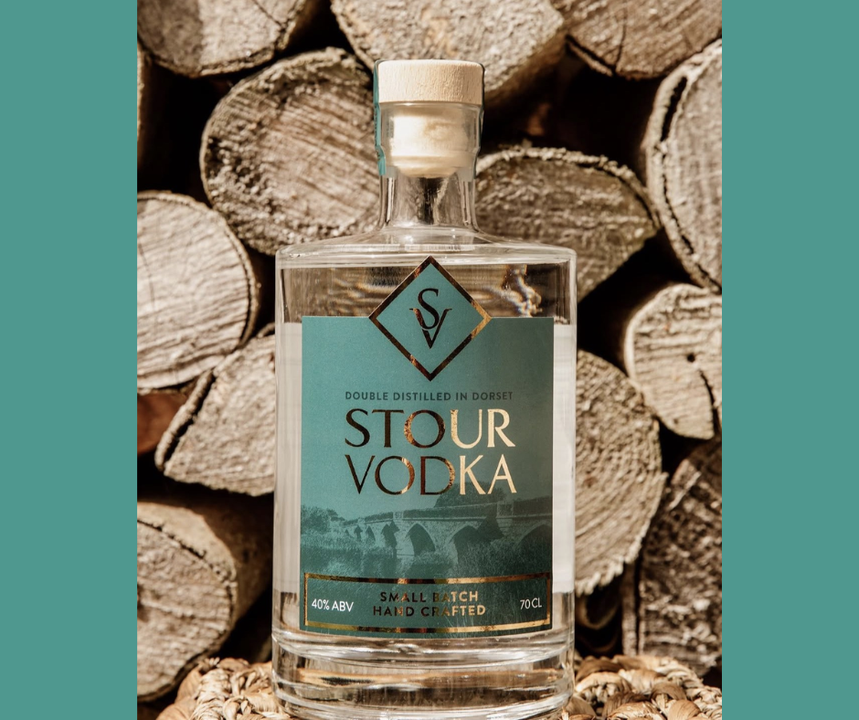 Stour Vodka by Beaucroft Beverages, an artisan Dorset vodka handmade in small batches and photographed in front of a natural wood backdrop.