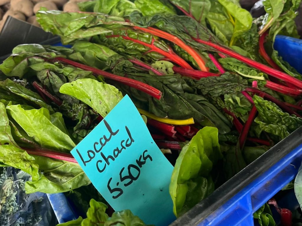 Locally grown Swiss chard for sale at a Dorset market stall.