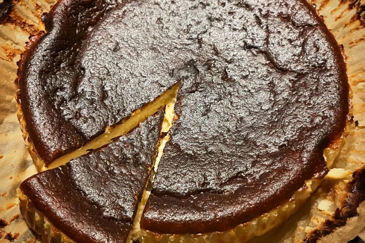 Handmade baked cheesecake with a caramelised top, freshly prepared by The Burnt Squash Kitchen & Bakery in Dorset.