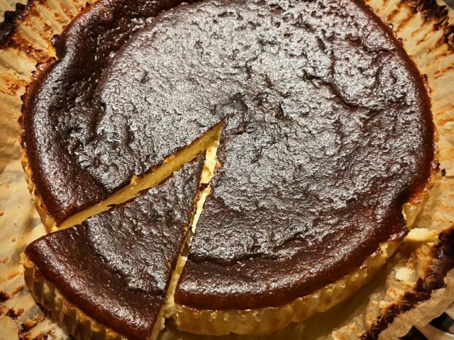 Handmade baked cheesecake with a caramelised top, freshly prepared by The Burnt Squash Kitchen & Bakery in Dorset.