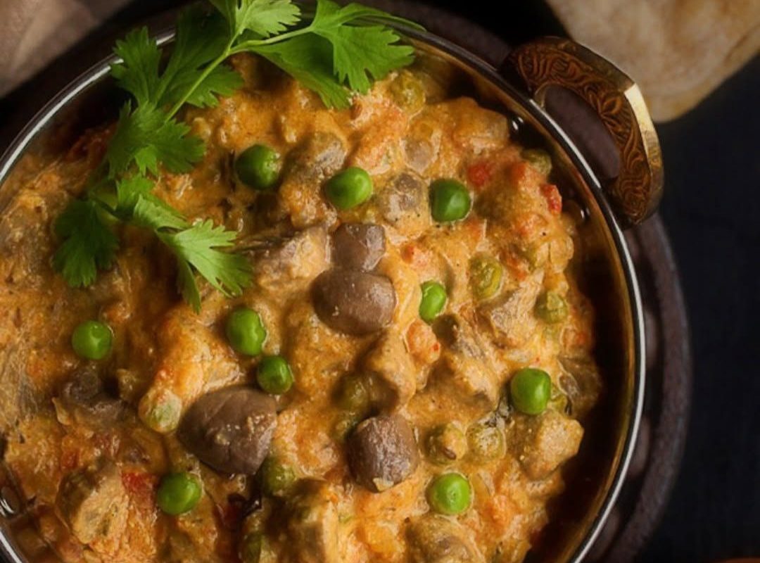 Rich and flavourful chicken curry with vegetables and herbs, celebrating the authentic home cooking at the heart of Julia's World Kitchen.